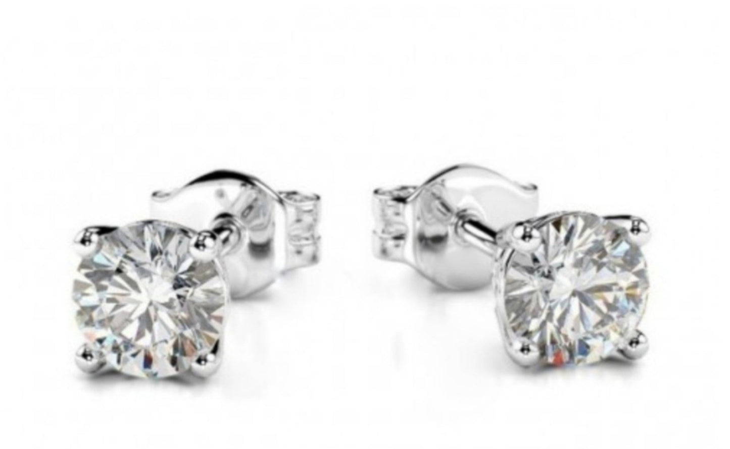 Pendientes punto de luz oro blanco 18k y 2 diamantes naturales 0,20ct