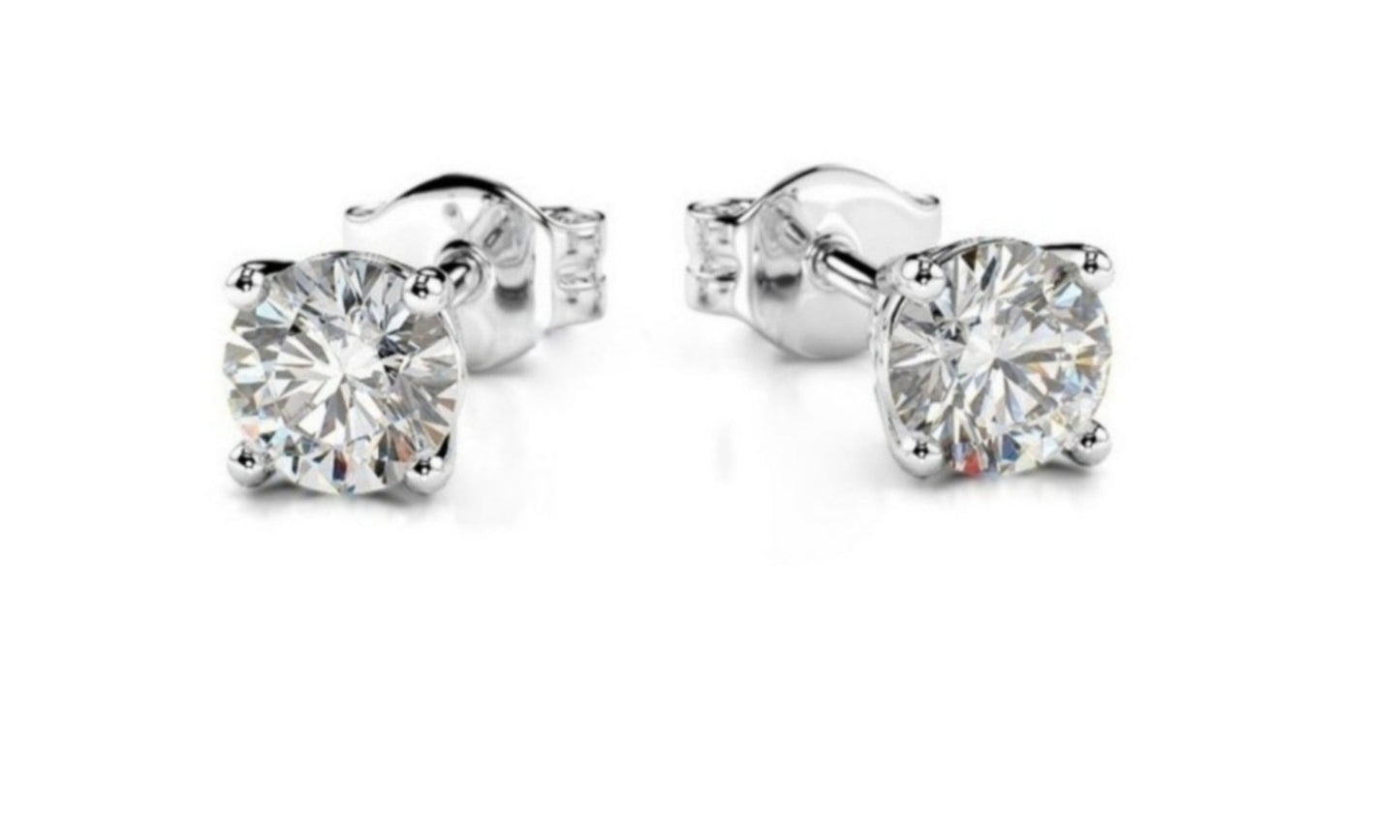 Pendientes punto de luz oro blanco 18k y 2 diamantes naturales 0,20ct